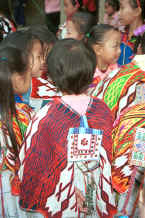 Jpeg 48K Back view of young Big Flower girl in her festival cape with her friends - Xian Ma village, Hou Chang township, Puding county, Guizhou province 0010x22.jpg