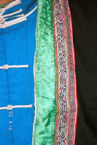 Detail of Side Comb Miao woman's jacket front and blouse - Xian Ma village, Hou Chang township, Puding county, Guizhou province 0010y36.jpg