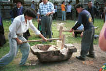 Jpeg 38K Young Black Miao men kneading the sticky rice served at festivals - Zuo Qi village, Min Gu township, Zhenfeng county, Guizhou province 0010p32.jpg