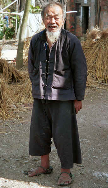 Old man - note his traditional sandals - in Black Miao village, Zuo Qi village, Min Gu township, Zhenfeng county, Guizhou province 0010q20.jpg
