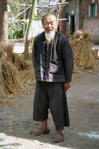 Jpeg 28K Old man - note his traditional sandals - in Black Miao village, Zuo Qi village, Min Gu township, Zhenfeng county, Guizhou province 0010q20.jpg