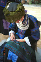 Jpeg 36K Black Miao girl working on the border which goes on the bottom of a woman's skirt - Zuo Qi village, Min Gu township, Zhenfeng county, Guizhou province 0010q36.jpg