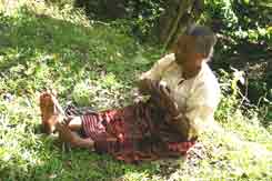 to 54K Jpeg 0184 Winding the cotton thread off into balls after spinning - one of the weavers of Watublapi, Flores, who use homegrown cotton and natural dyes for their weaving, showing their traditional weaving skills (2004)