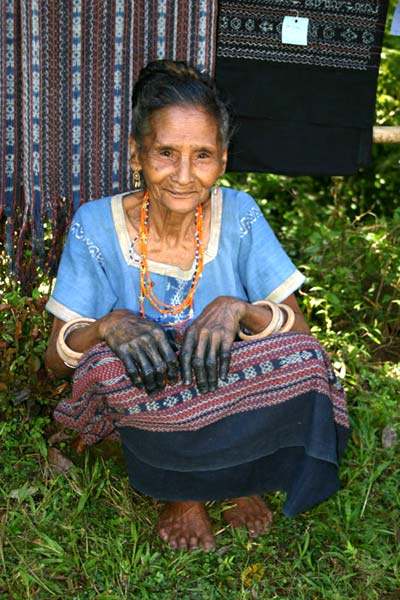 58K Jpeg 0195 One of the weavers of Watublapi, Flores, who use homegrown cotton and natural dyes for their weaving (2004). Note the indigo dye stains on her hands.