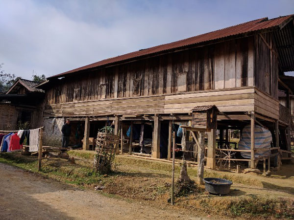 Family home in Xam Nuea. The houses here are lovely wooden homes and every one we saw had at least one well used loom in the cool space under the home.