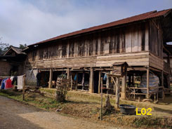 Family home in Xam Nuea. The houses here are lovely wooden homes and every one we saw had at least one well used loom in the cool space under the home.