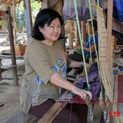 Haha! I couldn't resist sitting down at a loom and pretending to be a weaver!