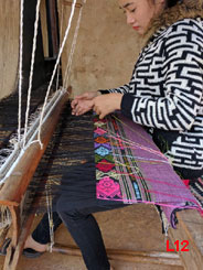 We met this young lady weaving a piece under the family home near Xam Nuea. Her fingers just flew with incredible speed. (Wish I could upload the video but it's too big) 