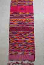 to Jpeg 97K A modern cotton supplementary weft woven pha chet purchased in northern Thailand in 1988 - and probably woven during that decade. The bright dyes are very clearly chemical but the weaving is very fine.