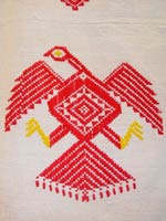 77K Jpg - 02 - Detail 1 of Itneg cotton decorative cloth with Spanish diamond eagle design, Northern Luzon, early 20th century. This piece was made from hand-spun, hand-woven cotton and is signed with the weaver's embroidery. 154 cm x 220 cm without fringe