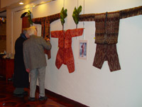 67K Jpg Dr Reiman discussing one of the abaka exhibits with a reception guest. Photo taken at the opening reception held in the evening of February 4, 2008 for the exhibition of Filipino textiles from the collection of Myunghee & Peter Reimann as exhibited at the Philippine Centre, Philippine Consultate General, New York from February 4-15, 2008.