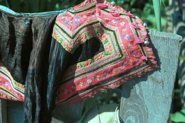 Blue Hmong boy's jacket hanging out to dry in a village on Doi Chiang Dao along the road from Chiang Mai to Fang 8812o01