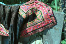 to Jpeg 40K Blue Hmong boy's jacket hanging out to dry in a village on Doi Chiang Dao along the road from Chiang Mai to Fang 8812o01