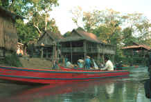 to Jpeg 36K  Boats at the shore of a Sgaw Karen village along the Mae Kok river between Tha Thon and Chiang Rai in northern Thailand 8812p04.jpg
