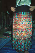 to Jpeg 84K An embroidered panel for a pair of Yao women's trousers.  This was purchased in December 1988 in Chiang Mai night market from the Yao woman who had embroidered it. 8812m14.jpg