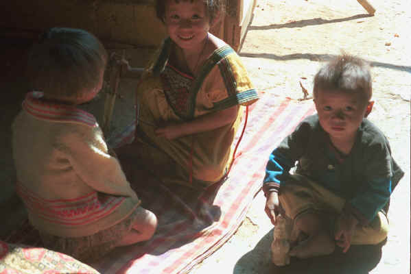 Yao children playing inside a house door-way in a village in the hills around Chiang Rai 8812q15.jpg