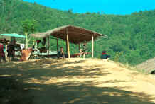 to Jpeg 37K Yao man smoking a waterpipe in a village in the hills around Chiang Rai 8812q21.jpg