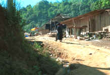 to Jpeg 38K Yao old woman walking up into the village in the hills around Chiang Rai in Northern Thailand 8812q25.jpg