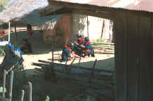 to Jpeg 24K Yao women sitting in the sun working on their embroidery in a village in the hills around Chiang Rai 8812q27.jpg
