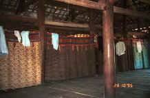 to Jpeg 31K Curtains separating off the sleeping areas from each other and from the living area in a Black Thai House.  Note the hand woven material in several curtain headings as well as patchwork.  Dien Bien Phu.  Lai Chau Province. 9510C36.JPG