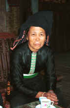 to Jpeg 23K Black Thai woman in her home in a village near Dien Bien Phu.  she wove and died the material for her head cloth from locally grown indigo.  She is the wife of the local Party Secretary. 9510D08.JPG