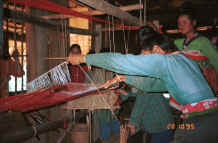 to Jpeg 30K Black Thai women demonstrating weaving on a length of weaving for bags and bedding/cushion ends in a village near Dien Bien Phu, Lai Chau Province 9510D18.JPG