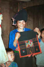 to Jpeg 30K Black Thai woman with an embroidered head cloth.  See notes to photo to the left of this one in the Photo gallery.  Dien Bien Phu, Lai Chau Province. 9510D22.JPG