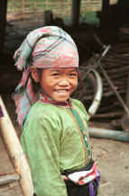 to Jpeg 30K Black Thai young girl, Dien Bien Phu, Lai Chau Province.  Note that the front of her blouse is fastened with buttons rather than the silver clasps of her elders.   9510F25.JPG