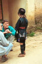 to Jpeg 23K Black Hmong woman talking to tourists in the streets of Sa Pa, Lao Cai Province 9510I17.JPG