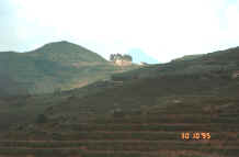 to Jpeg 13K A ruined church left from the French occupation in the hills around Sa Pa, Lao Cai Province.  Note the terraced fields in the foreground. 9510I33.JPG