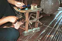 to Jpeg 50KGirl winding bobbins for weaving in Ban Lac village, Mai Chau District in Hoa Binh Province near the border with the north-western part of Thanh Hoa Province in north west Vietnam 9510A11T
