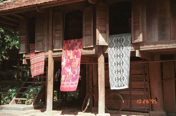 Southern White Thai weavings hanging outside houses in In Ban Lac village in the Mai Chau district, Hoa Binh (Ha So’n Binh) Province 9510A18E