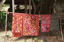 to Jpeg 79K Southern White Thai weavings hanging outside houses in In Ban Lac village in the Mai Chau district, Hoa Binh (Ha Son Binh) Province, Vietnam 9510A19T